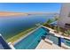 Infinity pool overlooking the lake, blending seamlessly with the water and horizon at 1548 Pleasant Bay Ct, Henderson, NV 89011