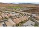 Aerial view of a residential area with well-maintained homes and desert scenery at 16 Via Stefano, Henderson, NV 89011
