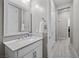 Bathroom featuring vanity with mirror, cabinet storage, and neutral tones at 16 Via Stefano, Henderson, NV 89011