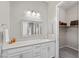 Bathroom featuring vanity with mirror and walk-in closet with storage at 16 Via Stefano, Henderson, NV 89011