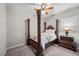 Bedroom with ceiling fan, wooden bed frame and side table with lamp at 16 Via Stefano, Henderson, NV 89011