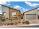 Contemporary single-story home with desert landscaping and two-car garage at 16 Via Stefano, Henderson, NV 89011