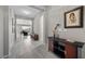 Spacious foyer with tile flooring, art display, and an open view to the living area at 16 Via Stefano, Henderson, NV 89011