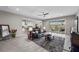 Relaxing living room featuring tile floors and sliding doors to the outdoor space at 16 Via Stefano, Henderson, NV 89011