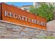 Regatta Heights community sign made with stone and desert plants at 16 Via Stefano, Henderson, NV 89011