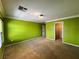 Green bedroom featuring a closet with white doors, carpet, and crown molding at 2112 Merganser Ct, North Las Vegas, NV 89084