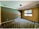 Bedroom featuring modern color scheme with a large window and neutral carpet at 2112 Merganser Ct, North Las Vegas, NV 89084