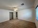 Bedroom featuring a ceiling fan, carpet, and window with blinds at 2112 Merganser Ct, North Las Vegas, NV 89084