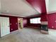 Bonus room with neutral carpeting, fireplace, and door to another room at 2112 Merganser Ct, North Las Vegas, NV 89084
