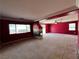 Bonus room showcasing a fireplace, window, ceiling fan, and carpet floors at 2112 Merganser Ct, North Las Vegas, NV 89084