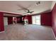 Bonus room featuring neutral carpet, fireplace, and lots of space at 2112 Merganser Ct, North Las Vegas, NV 89084