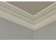 Detailed crown molding accentuates the ceiling, enhancing the room's elegance at 2112 Merganser Ct, North Las Vegas, NV 89084