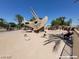 Community dinosaur themed park with multiple large dinosaur statues for children to climb on at 2112 Merganser Ct, North Las Vegas, NV 89084