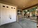 Inviting front entrance with a double door and stone accents on the covered porch area at 2112 Merganser Ct, North Las Vegas, NV 89084