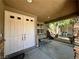 Inviting front porch features a swing and double-door entry at 2112 Merganser Ct, North Las Vegas, NV 89084
