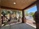 Spacious front porch with stone pillars and wrought iron railing, offering curb appeal and outdoor space at 2112 Merganser Ct, North Las Vegas, NV 89084