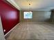 Spacious living room with neutral carpet and a chandelier at 2112 Merganser Ct, North Las Vegas, NV 89084