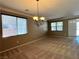 Spacious living room featuring neutral paint, carpet, and lots of natural light at 2112 Merganser Ct, North Las Vegas, NV 89084