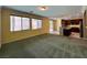 Open-concept living room and kitchen with natural light from windows and sliding door at 2112 Merganser Ct, North Las Vegas, NV 89084