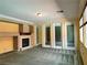 Bright living room with a fireplace and view of rooms through French doors at 2112 Merganser Ct, North Las Vegas, NV 89084