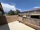 Relaxing outdoor patio area with neutral tones and wrought iron fencing, perfect for enjoying the backyard view at 2112 Merganser Ct, North Las Vegas, NV 89084