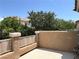 Spacious patio offering a private outdoor space with lush greenery and mature trees in the backyard at 2112 Merganser Ct, North Las Vegas, NV 89084