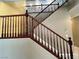 Beautiful wooden staircase with decorative railings leading to the upper level of the home at 2112 Merganser Ct, North Las Vegas, NV 89084