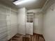 Walk-in closet with ample metal shelving and a built-in storage unit at 2112 Merganser Ct, North Las Vegas, NV 89084