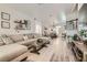 Spacious open living space with modern decor, wood floors, and lots of natural light at 2470 Lower Meadows Ave, Henderson, NV 89052