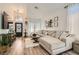 Bright living room with vaulted ceilings, wood-look floors, and stylish decor at 2470 Lower Meadows Ave, Henderson, NV 89052