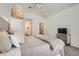 Inviting main bedroom with soft textures, neutral tones, decorative light fixture, and mirrored furniture at 2470 Lower Meadows Ave, Henderson, NV 89052