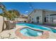 Inviting backyard pool and spa with patio area perfect for outdoor relaxation at 2470 Lower Meadows Ave, Henderson, NV 89052