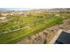 Aerial view of a meticulously maintained community park with lush greenery and walking paths at 253 Kindly Way, Henderson, NV 89011