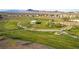 Overhead shot of a community park featuring green spaces and a charming central gazebo structure at 253 Kindly Way, Henderson, NV 89011