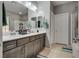 Bathroom featuring a double sink vanity with granite countertop and tile flooring at 253 Kindly Way, Henderson, NV 89011