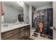 Bathroom featuring a double sink vanity with dark wood countertop and tile flooring at 253 Kindly Way, Henderson, NV 89011