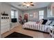Bedroom with light walls, ceiling fan, a window and a chest of drawers at 253 Kindly Way, Henderson, NV 89011