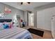 Bedroom with light walls, ceiling fan, closet and black carpet at 253 Kindly Way, Henderson, NV 89011