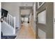 Inviting foyer with tile flooring, a staircase leading to the upper level, and a view of the living space at 253 Kindly Way, Henderson, NV 89011