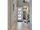 Bright foyer featuring tile flooring and a modern front door with glass inserts, with a view into the home at 253 Kindly Way, Henderson, NV 89011