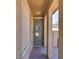 Inviting front porch featuring tiled flooring, a secure ring doorbell, and a green colored front door at 253 Kindly Way, Henderson, NV 89011