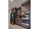 Kitchen featuring stainless steel appliances and dark wood cabinetry at 253 Kindly Way, Henderson, NV 89011