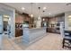 Spacious kitchen with a large island, stainless steel appliances, and stylish pendant lighting at 253 Kindly Way, Henderson, NV 89011