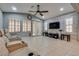 Cozy living room with comfortable seating and a large screen television at 253 Kindly Way, Henderson, NV 89011