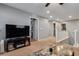 Loft area with a television, and marble top coffee table, perfect for entertaining at 253 Kindly Way, Henderson, NV 89011