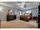 Spacious main bedroom features neutral paint, carpet and ceiling fan at 253 Kindly Way, Henderson, NV 89011