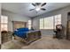Inviting main bedroom with a ceiling fan and two large windows at 253 Kindly Way, Henderson, NV 89011