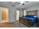 Comfortable main bedroom with neutral walls, a fan and ensuite bathroom at 253 Kindly Way, Henderson, NV 89011