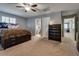 The Main bedroom features plush carpet, ceiling fan and an ensuite bathroom at 253 Kindly Way, Henderson, NV 89011