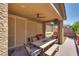 Covered outdoor living area features brick pavers and ceiling fan at 253 Kindly Way, Henderson, NV 89011